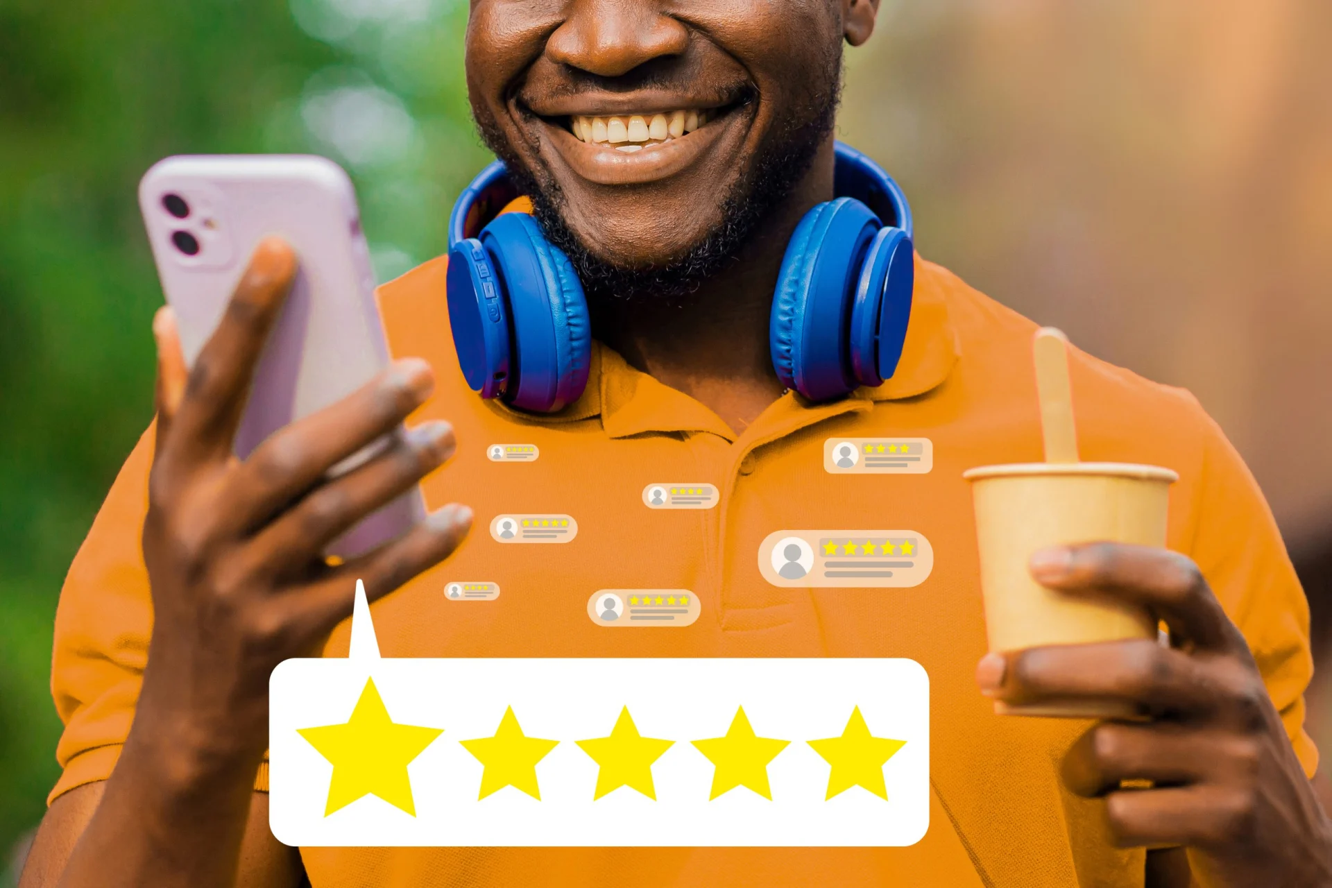 A man is holding a cell phone and smiling